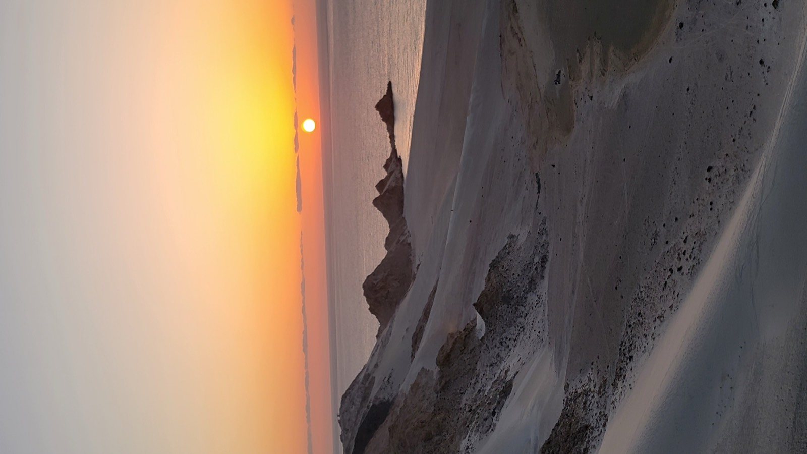 Sunset over the dunes and the sea